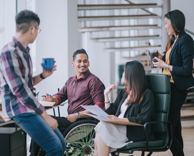 group of employees talking during a meeting