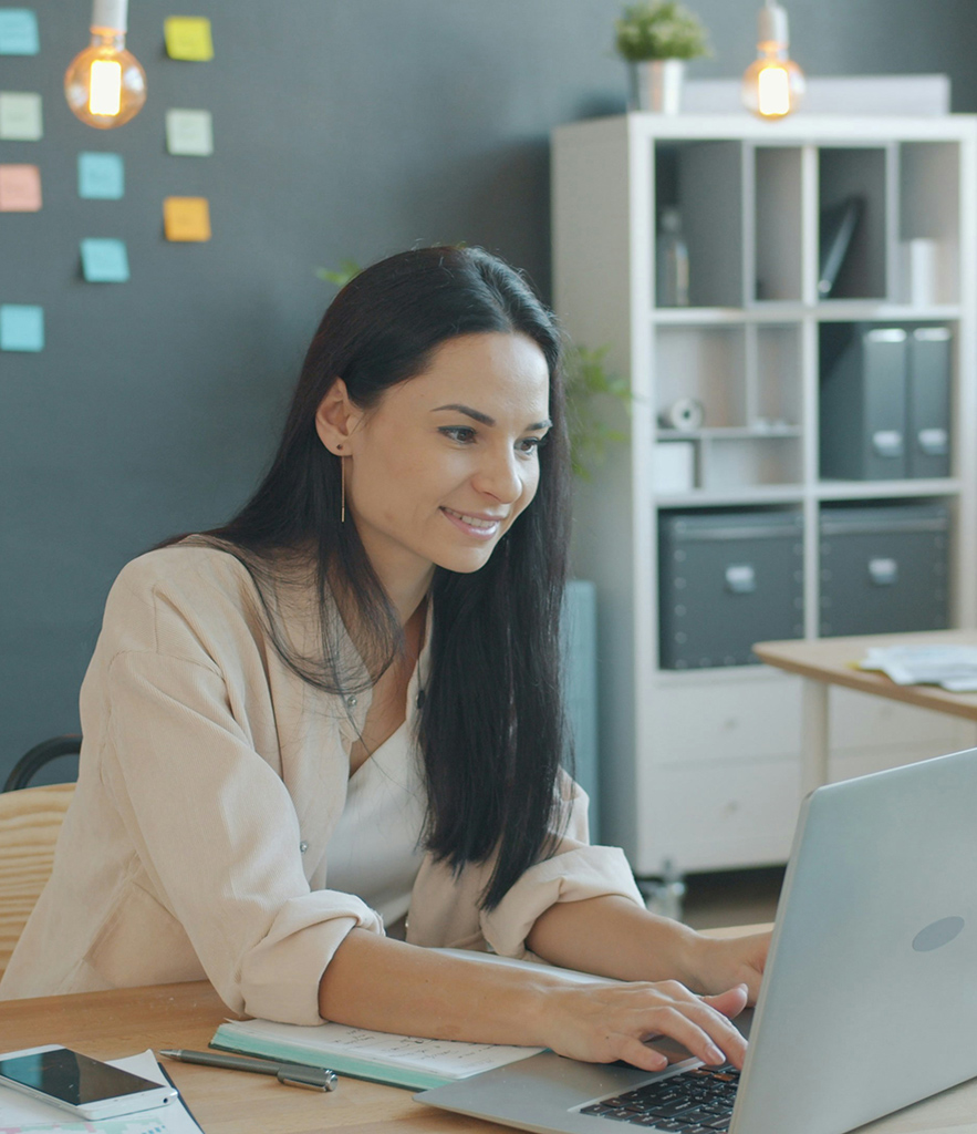 woman working on a laptop in modern office
